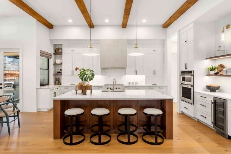 Custom kitchen remodel with wood beams and large island in Tampa Bay