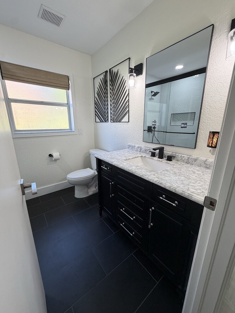 Bathroom remodel and water damage restoration after a drain leak caused mold in Tampa Bay by C&A Contracting