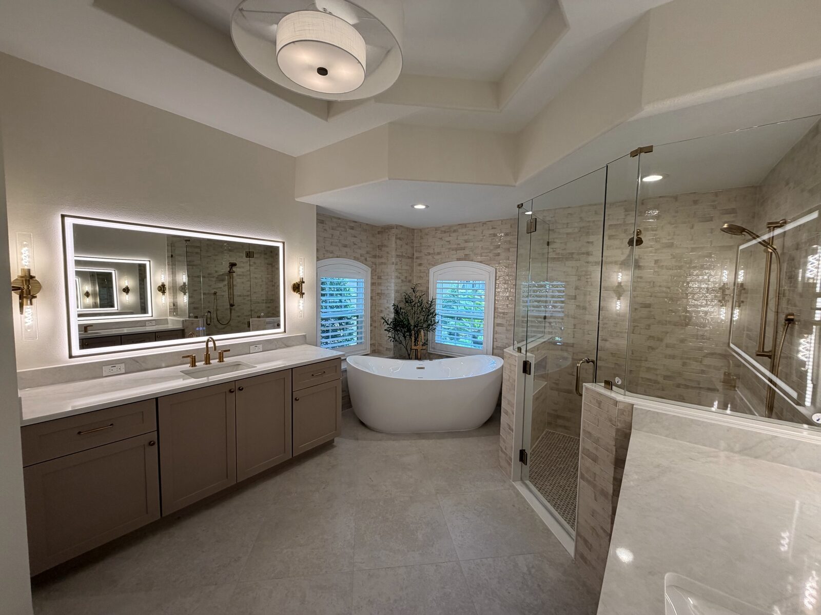 Luxury master bathroom remodel with Schluter shower system and custom cabinetry in Tampa Bay by C&A Contracting